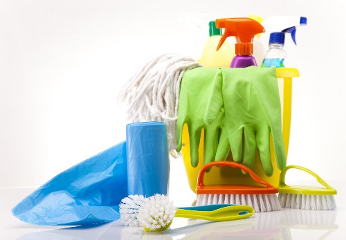 Vacuuming a sofa to remove dirt and allergens