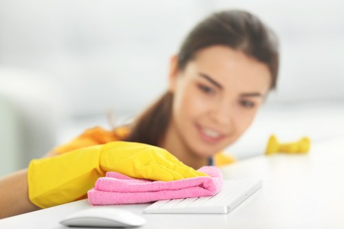 Technician performing hot water extraction on carpet